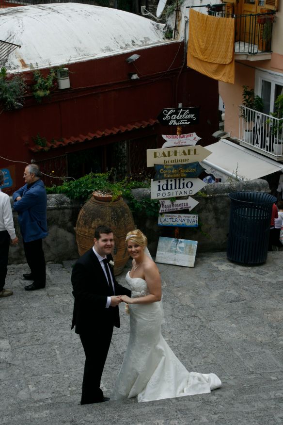 Posing on the steps in front of the church in Positano.