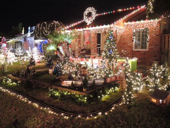 Model trains and Christmas lights on a home on El Segundo's Candy Cane Lane