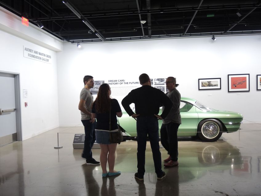 LA Formula 1 Fans at the Petersen Automotive Museum talk by a 1955 Chevrolet Biscayne XP-37