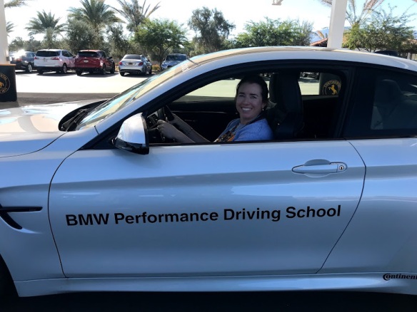 Kiera Reilly behind wheel of BMW m4 at BMW Performance Driving School #drive2learn conference with A Girl's Guide to Cars